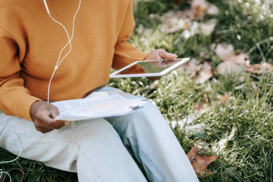 Person reviewing digital and paper documents representing hybrid government accessibility workflows